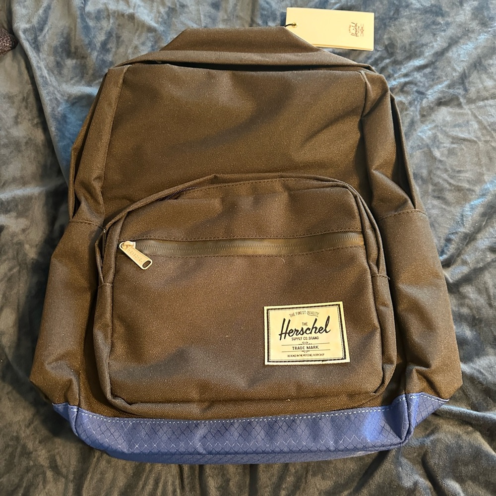 NWT Herschel backpack. Black with Blue accents. Red lining. Style Pop Quiz.